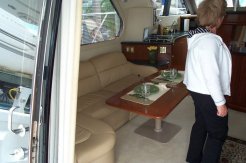 Entry into the salon via curved glass doors leading to the cockpit