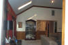 looking into the family room, towards the kitchen, from the bedroom hallway.