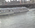 on the canals of Amsterdam -- This is a typical boat used to ferry passengers through the city. Unlike busses in other parts of the world, Amsterdam offers daily passes for people to travel through the city by boat instead of autos.