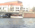 lots of water taxi's -- There are many types of boats plying the canals in Amsterdam. Shown here is one type. I found it interesting to see that most are commercial boats, with few (any?) private boats just cruising around the canals.
