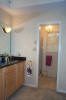 looking into the bathroom area from the family room. There&#39;s actually two rooms here, with the first one being the vanity.